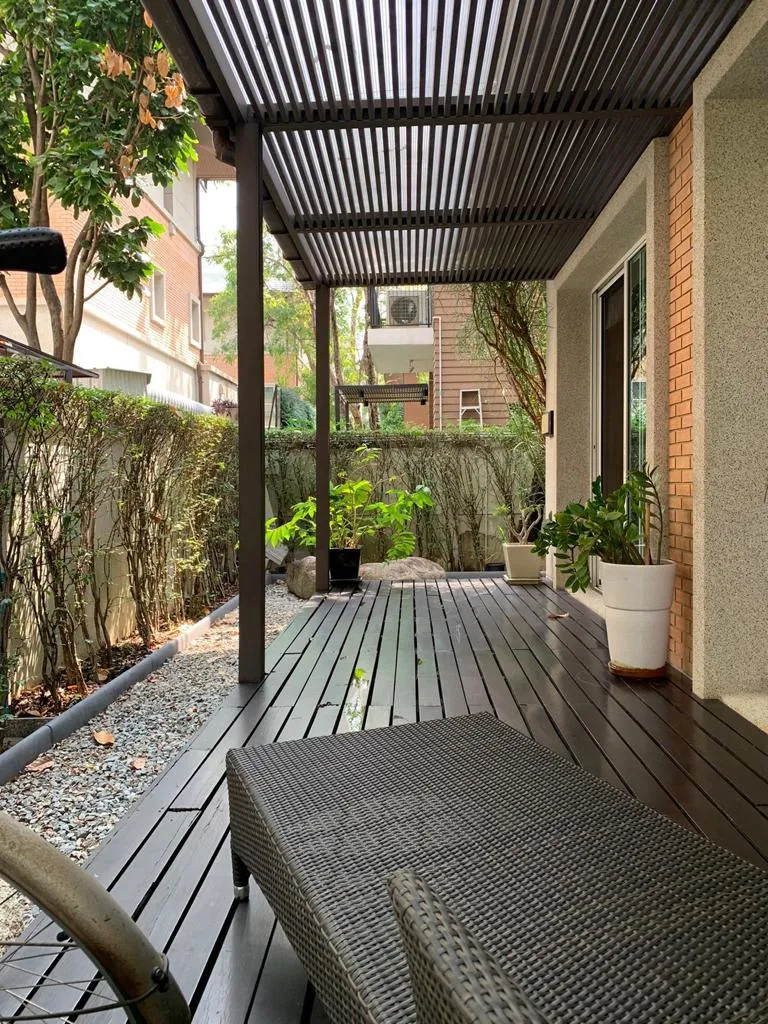 Shaded timber terrace with outdoor seating