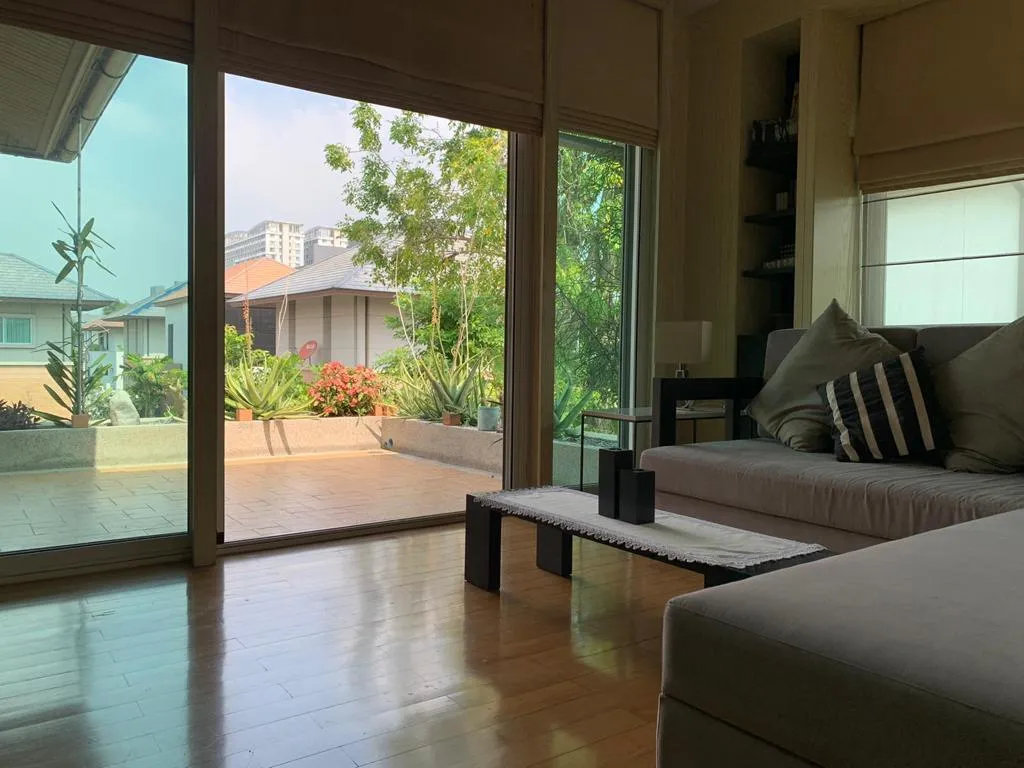 Sitting area opening onto an upper-floor terrace