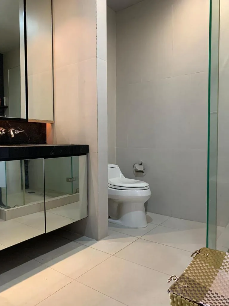 Bathroom with glass shower enclosure and fitted vanity