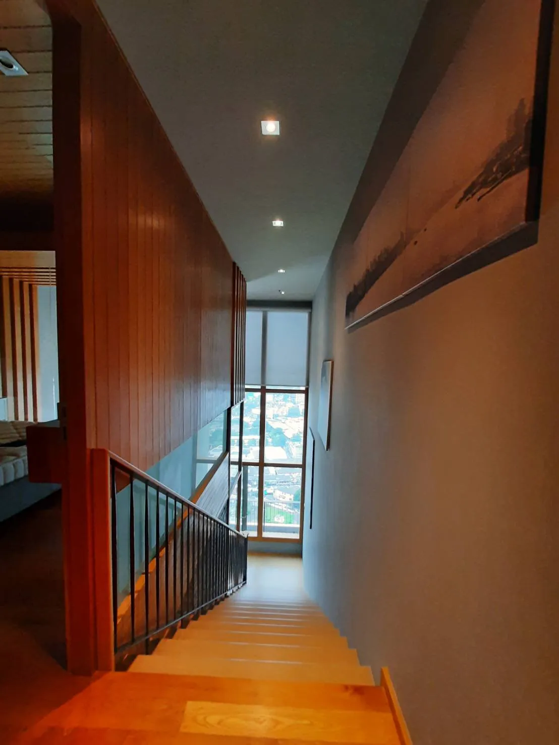Upper-floor hallway overlooking Bangkok
