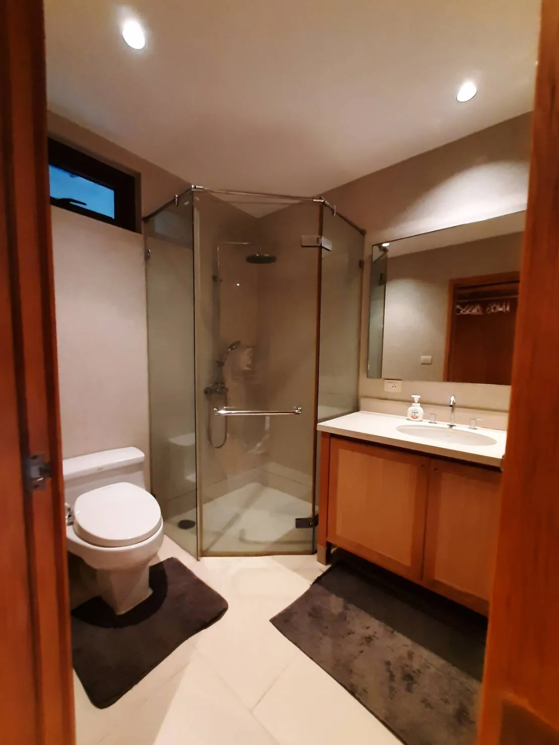 Bathroom with glass shower and fitted vanity
