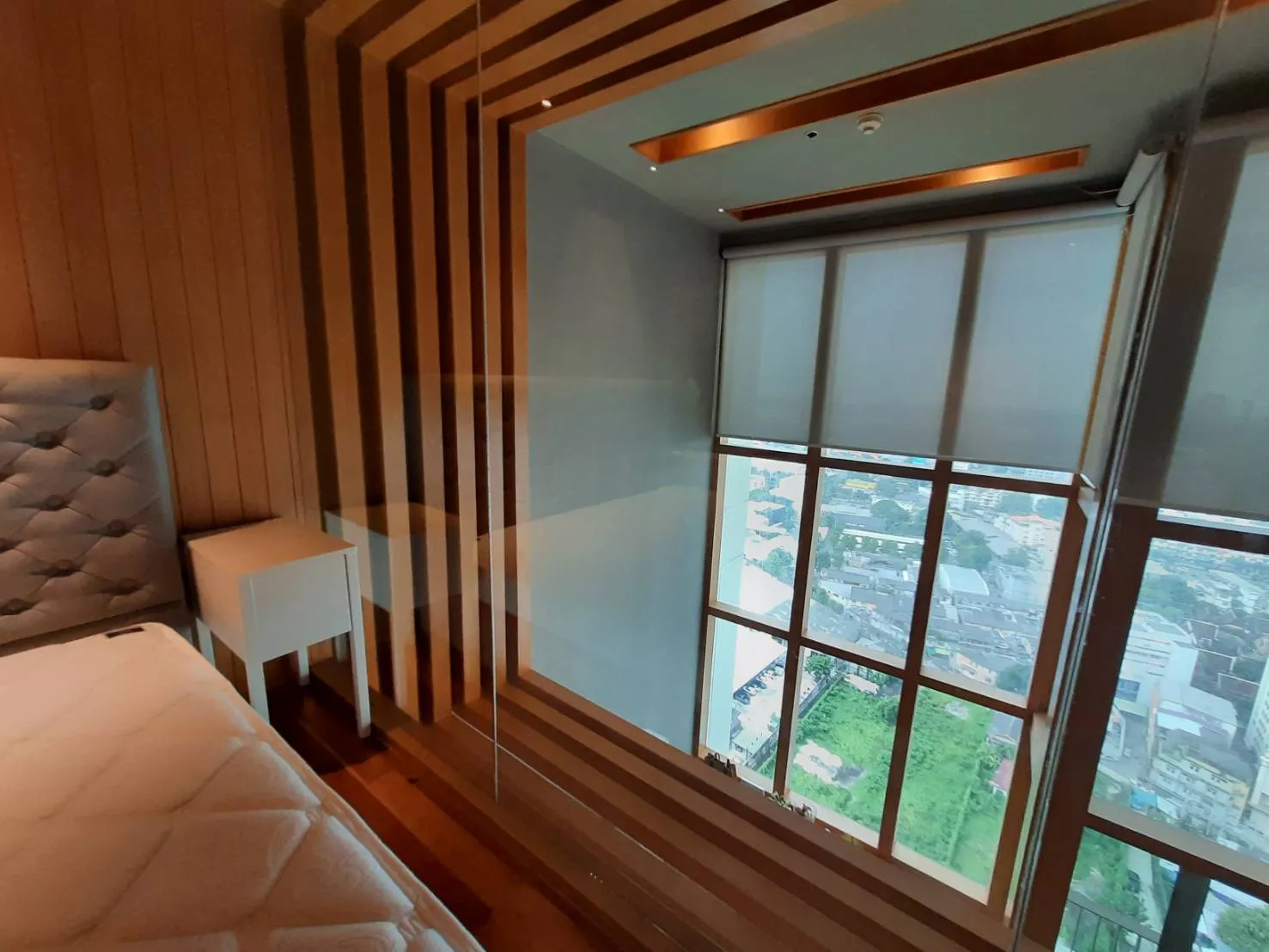 Bedroom desk framed by vertical timber details