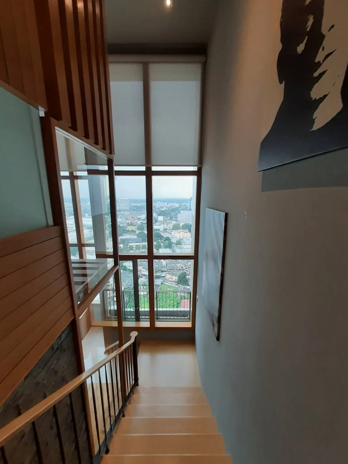 Upper stair landing with a full-height window