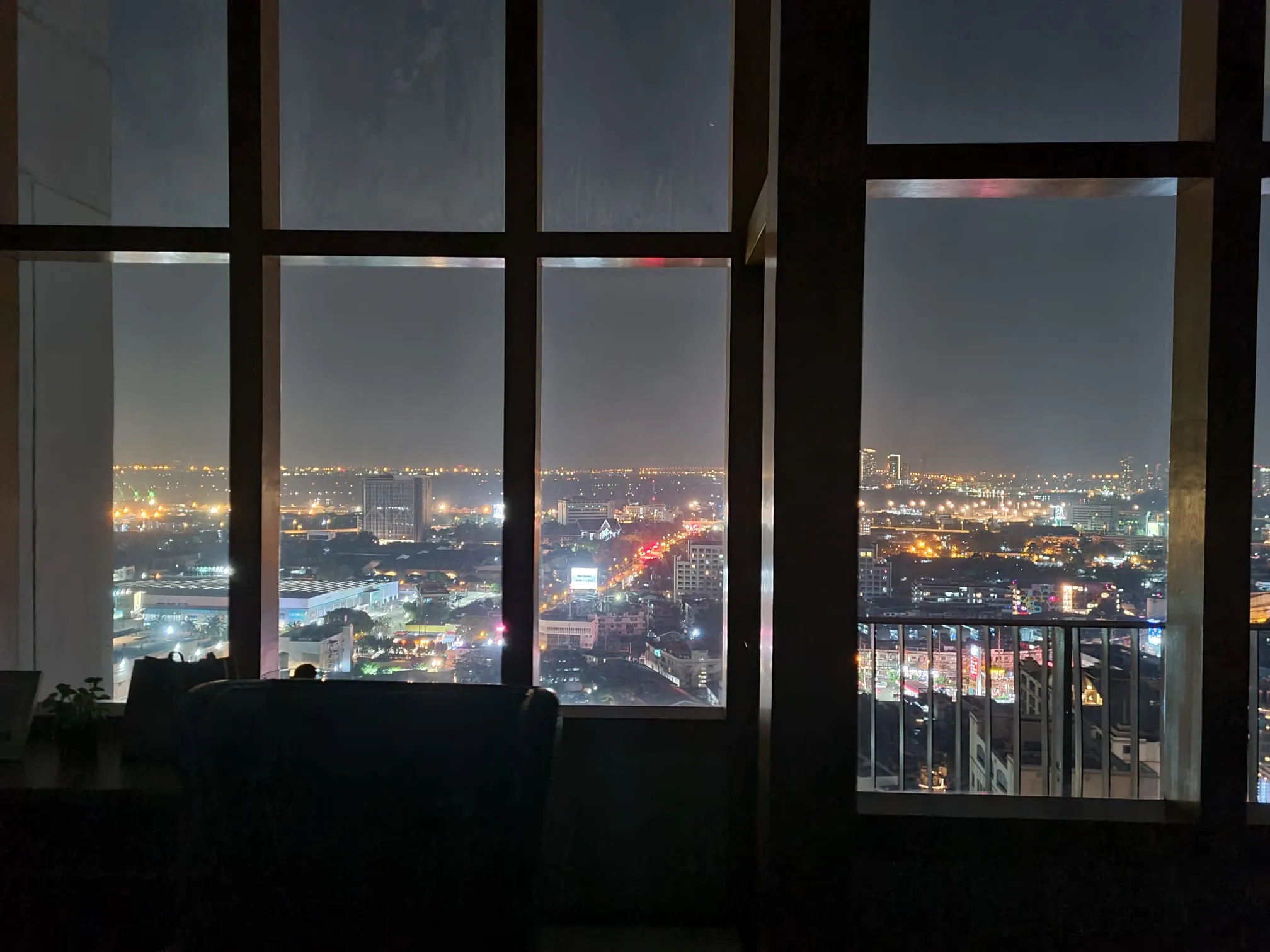 Bangkok lights seen through the residence windows at night