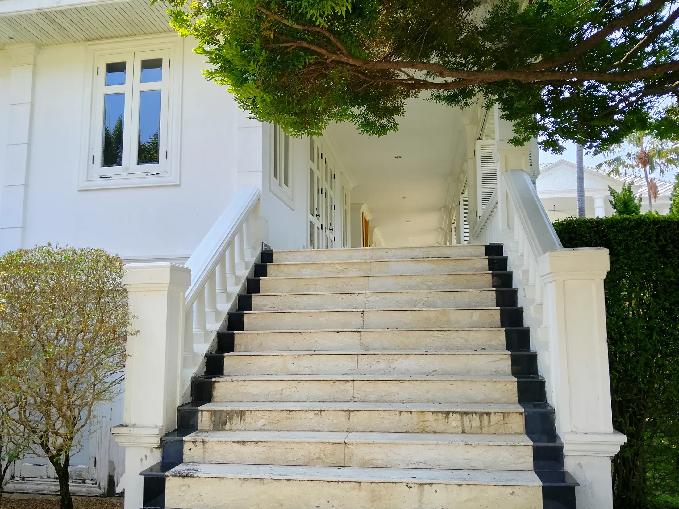 Broad marble steps leading to a residence