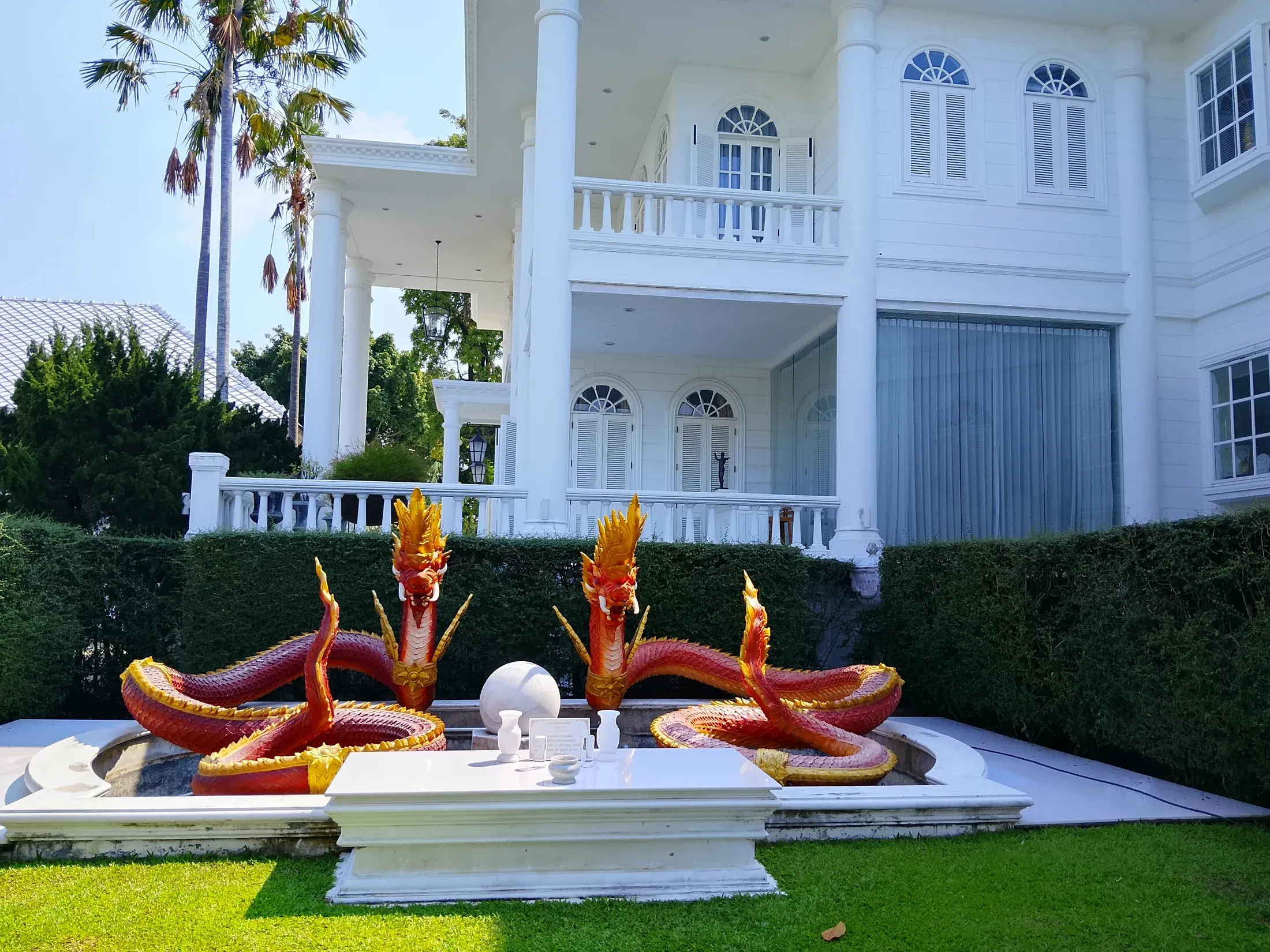 Decorative swan boat display beside the main residence