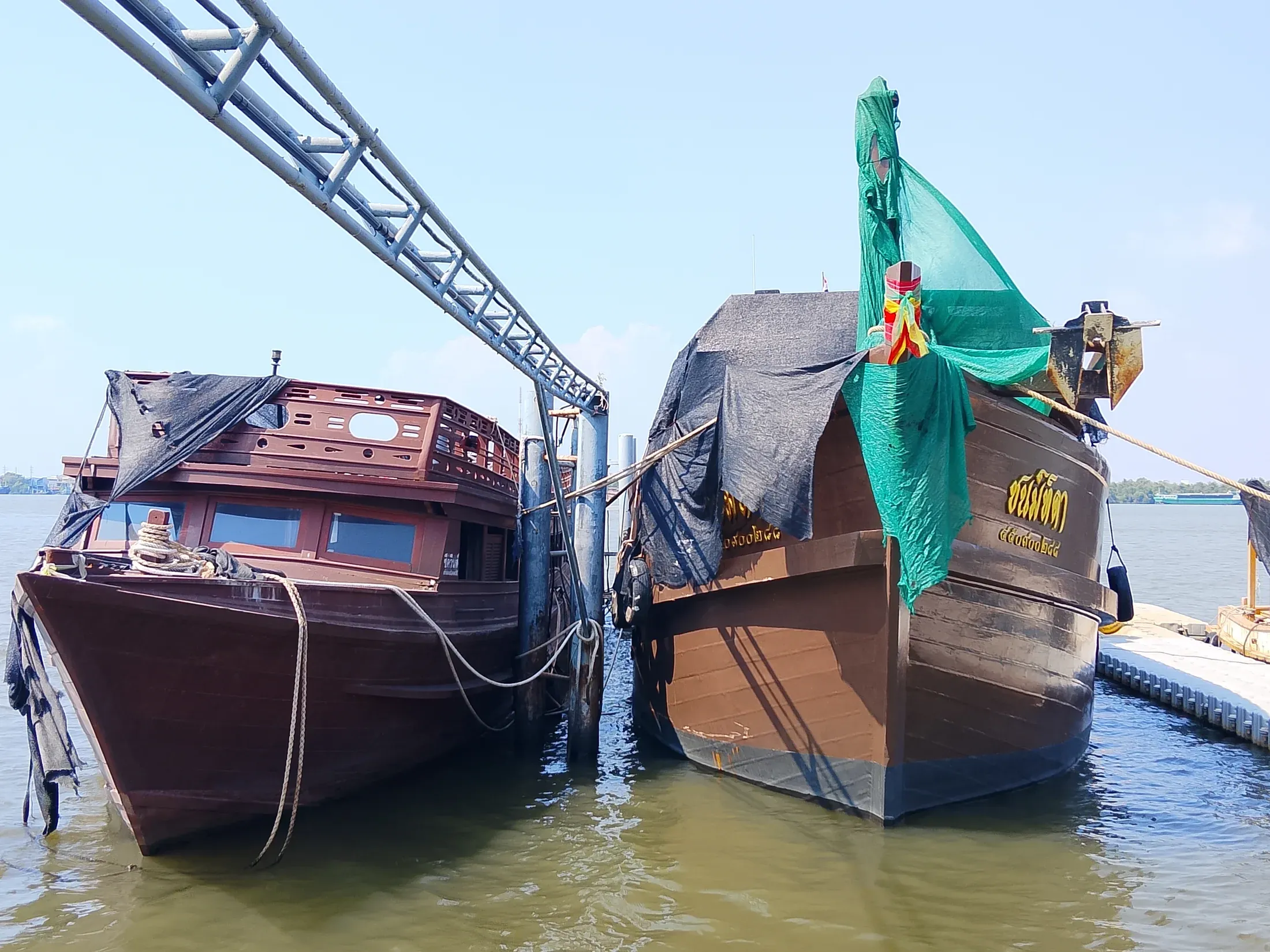 Stern of a wooden vessel at the private dock