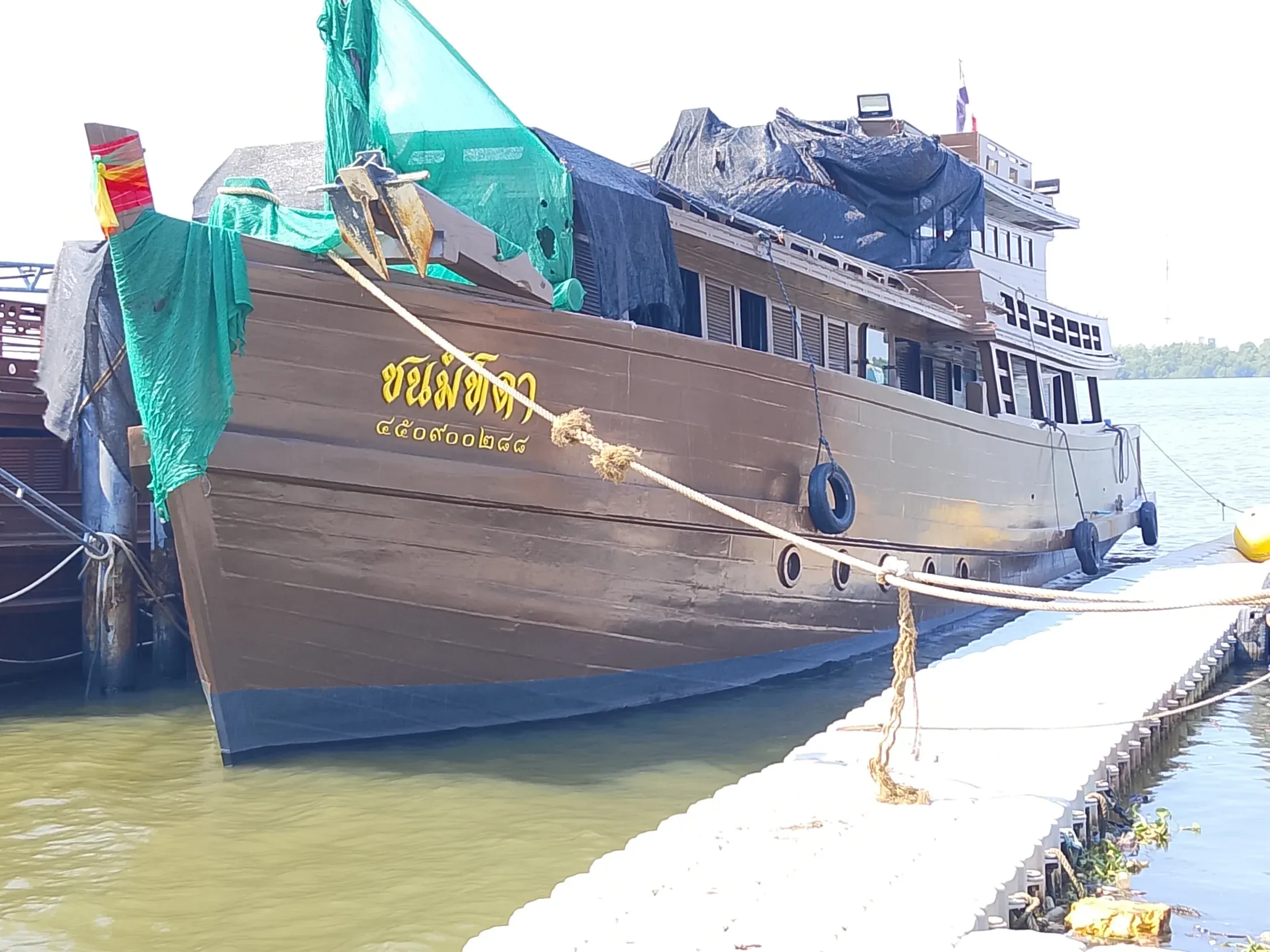 Wooden riverboat alongside the estate landing