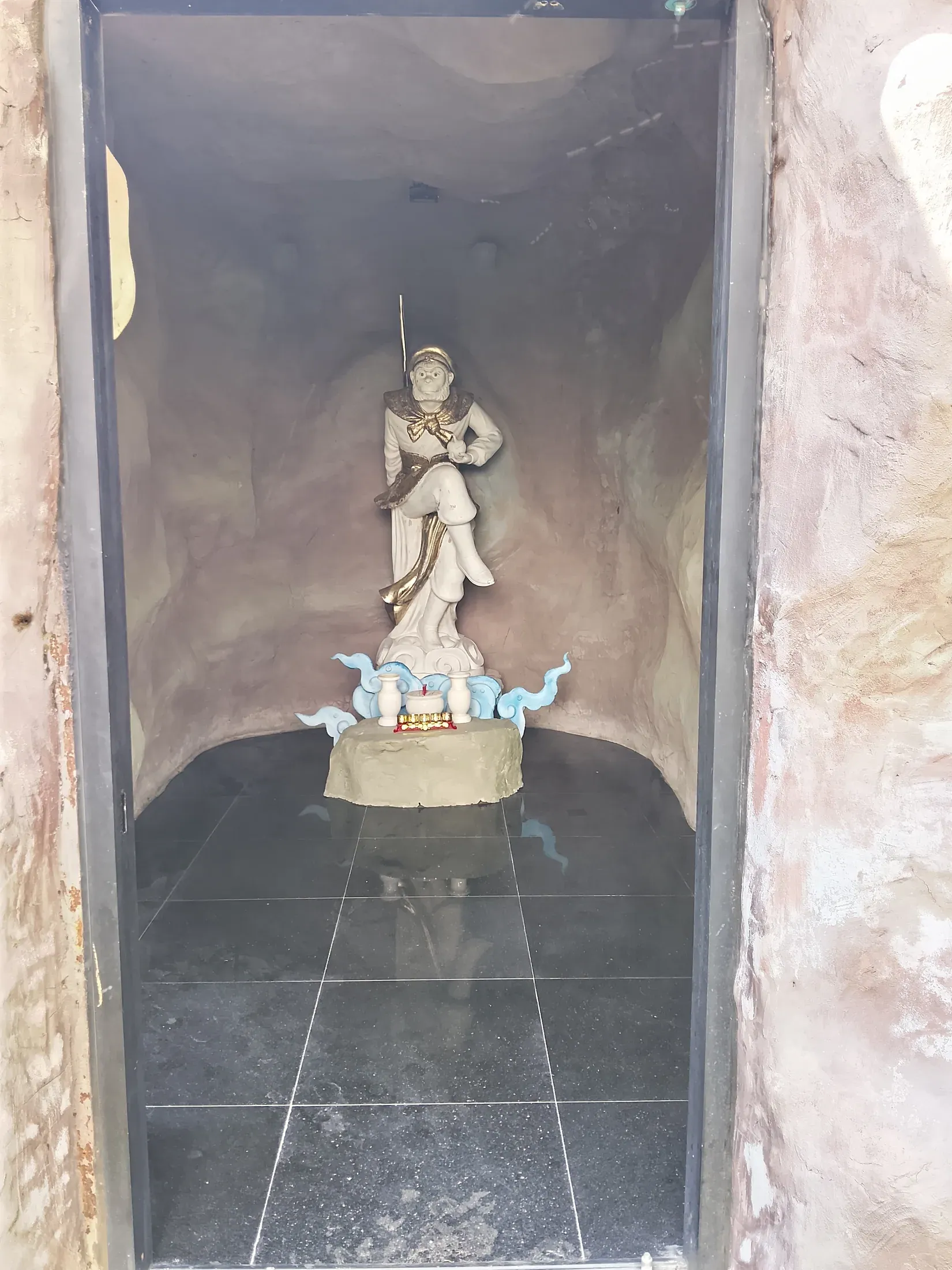 Decorative figure set into the spa rockwork