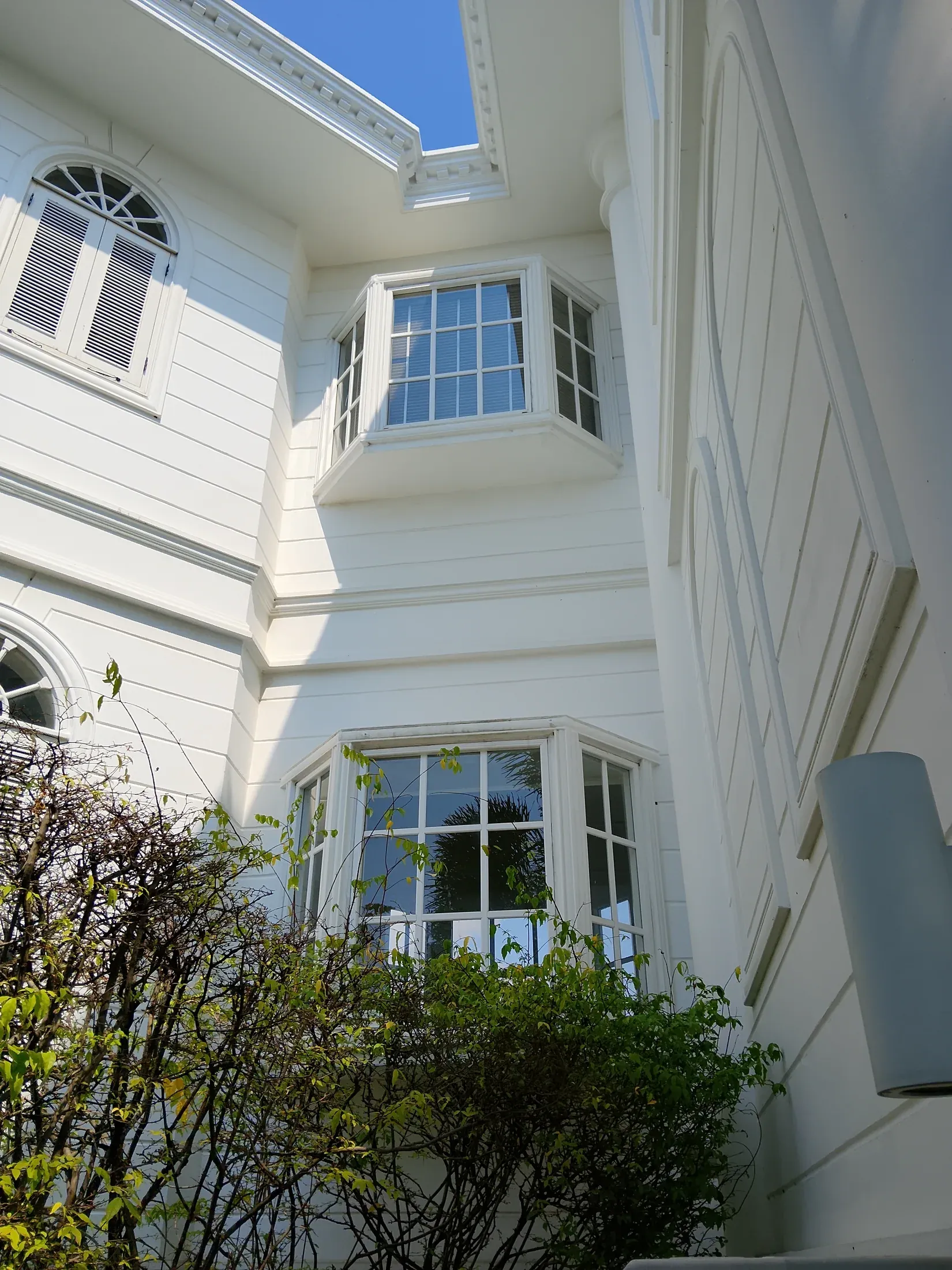 Bay window detail on the white residence